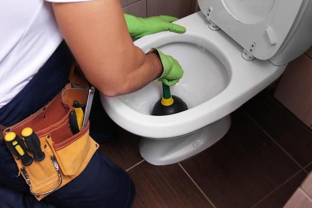 can one clogged toilet affect another
