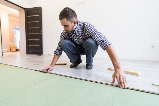 can you put carpet over laminate flooring