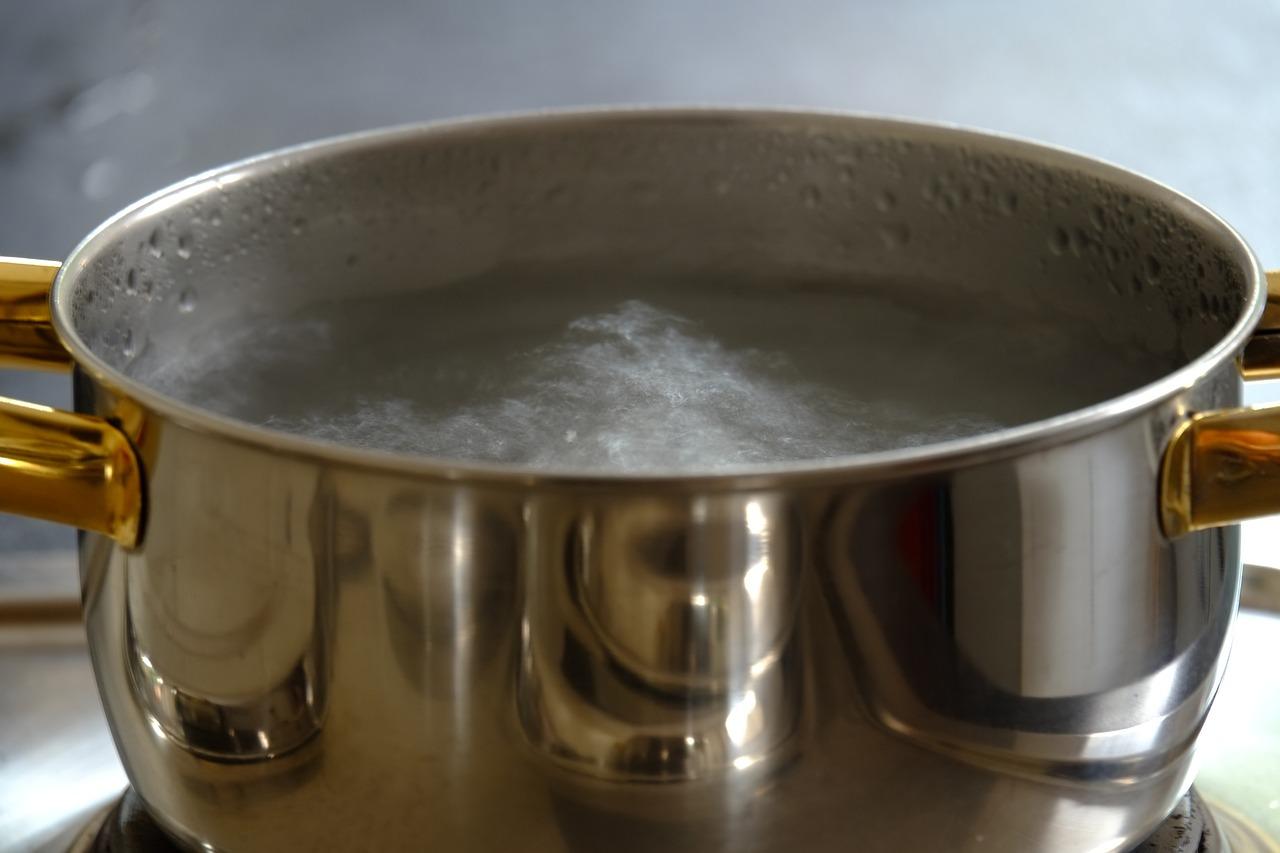 water heater water in pan